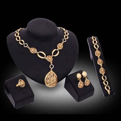“Women’s Four Piece Jewelry Set Necklace Earrings Bracelet Ring”